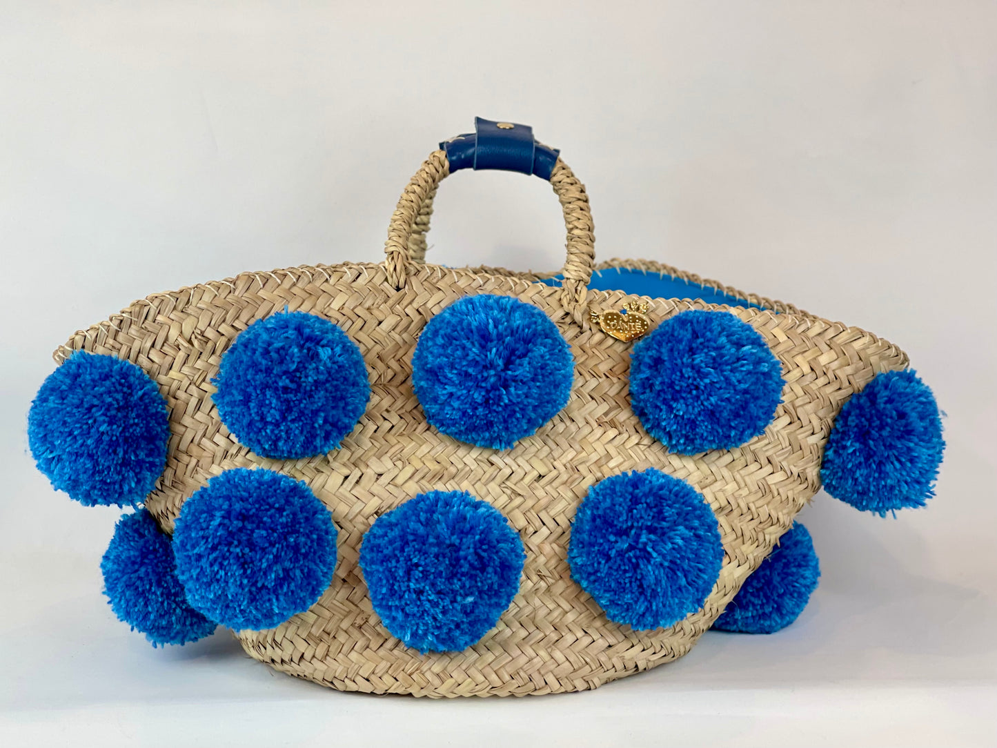 Handmade turquoise pom pom basket