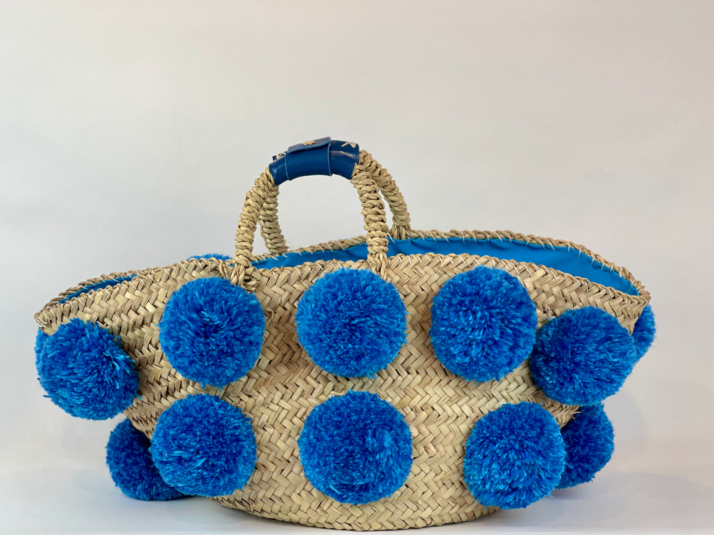 Handmade turquoise pom pom basket