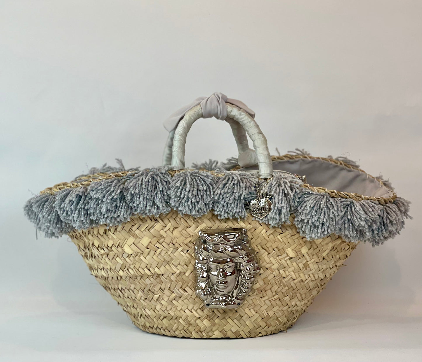 Basket with ceramic Maiden and silver pom pom