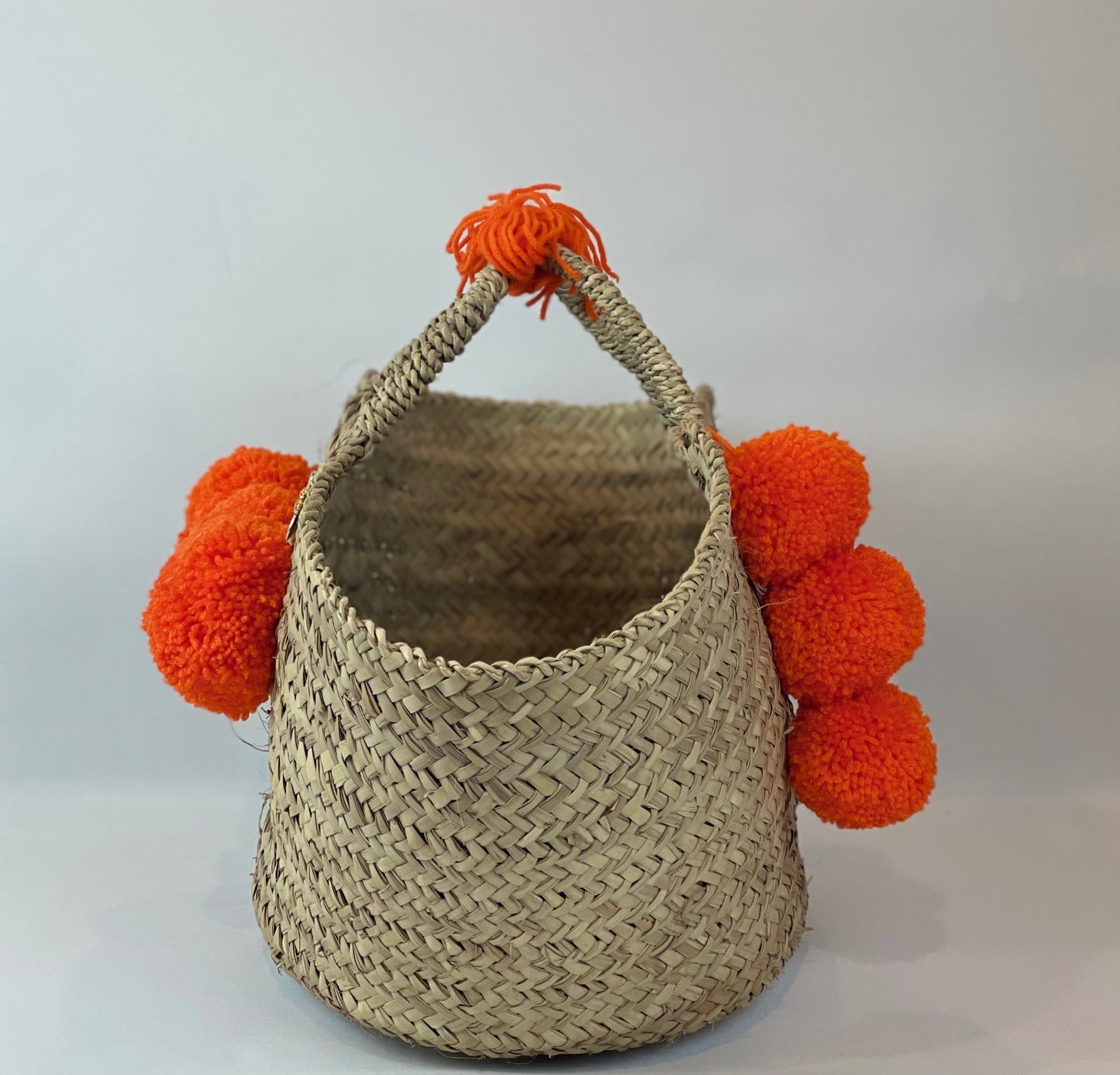 Large basket with yellow and black pom pom