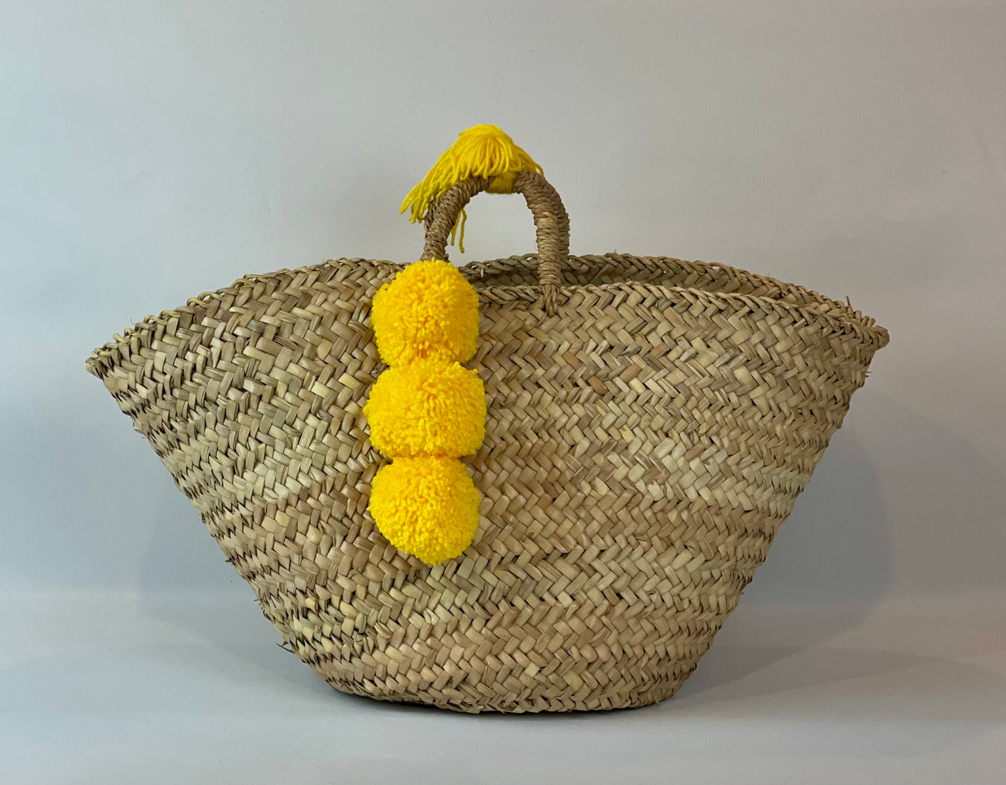 Basket with yellow pom pom