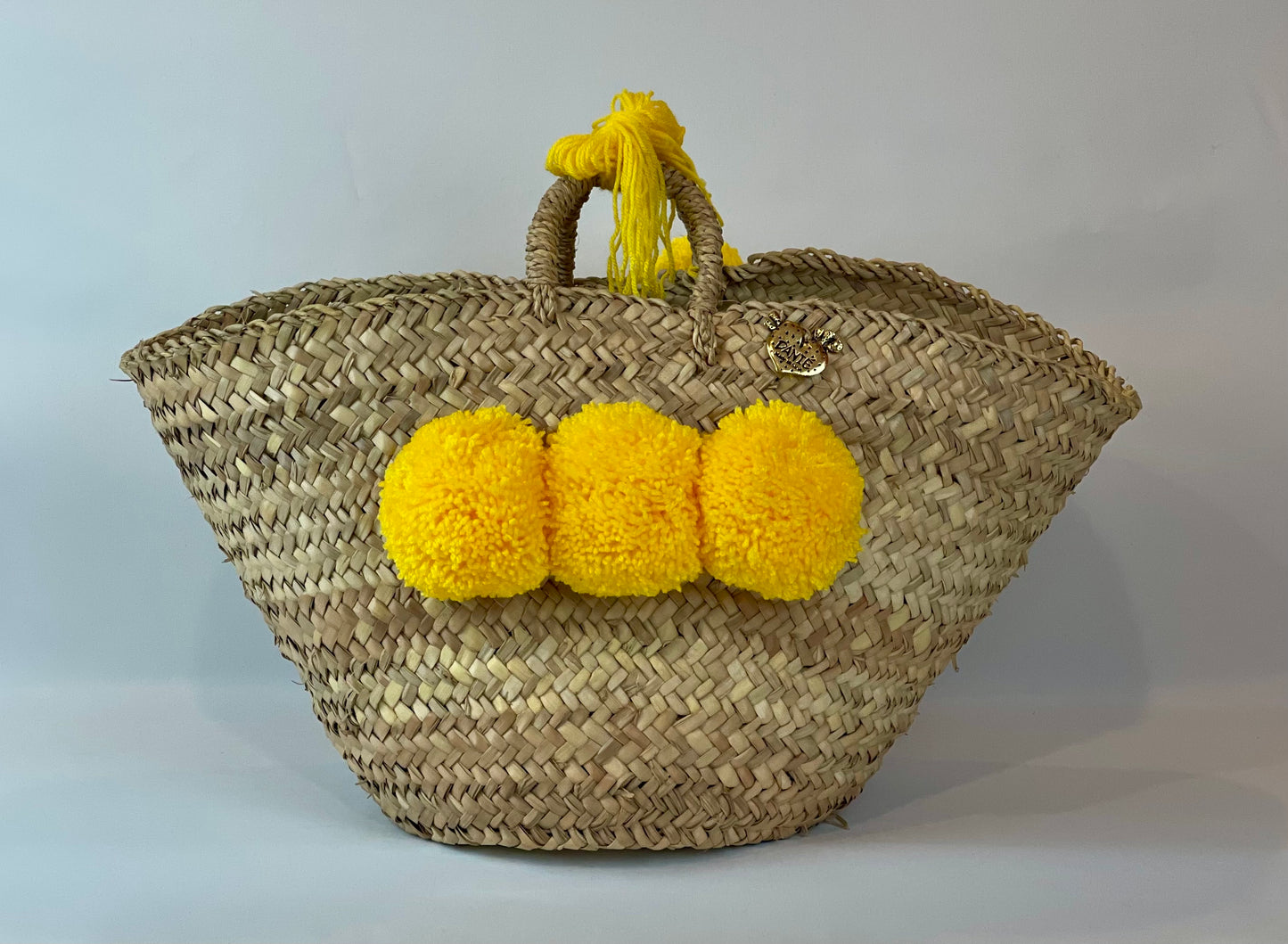 Basket with yellow pom pom