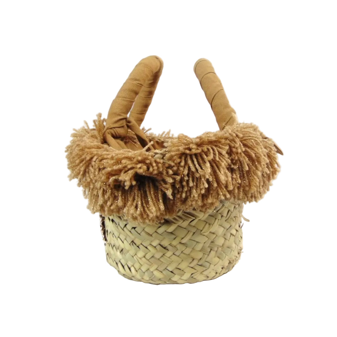 Basket with gold votive offering and beige pom poms