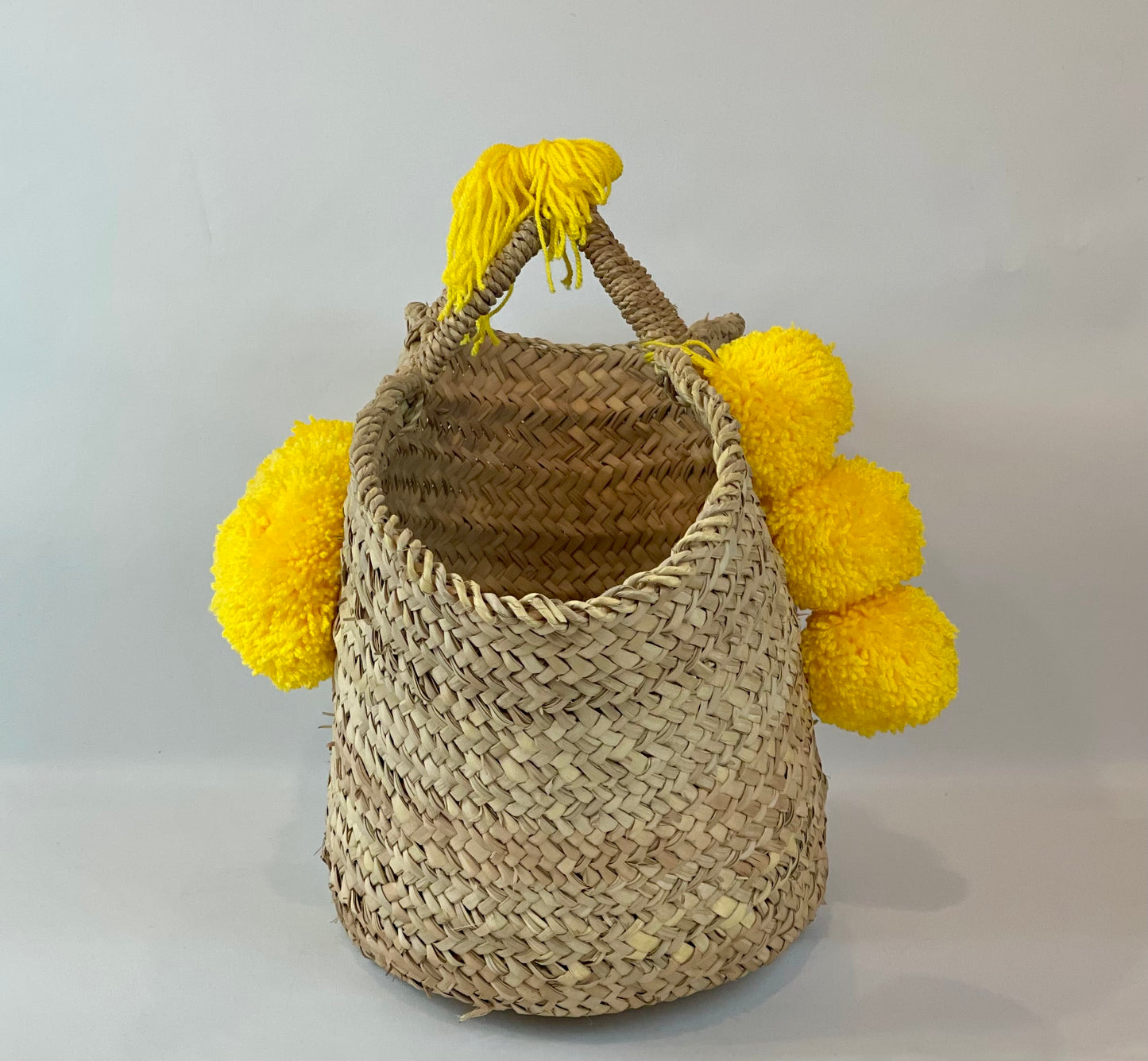 Basket with yellow pom pom