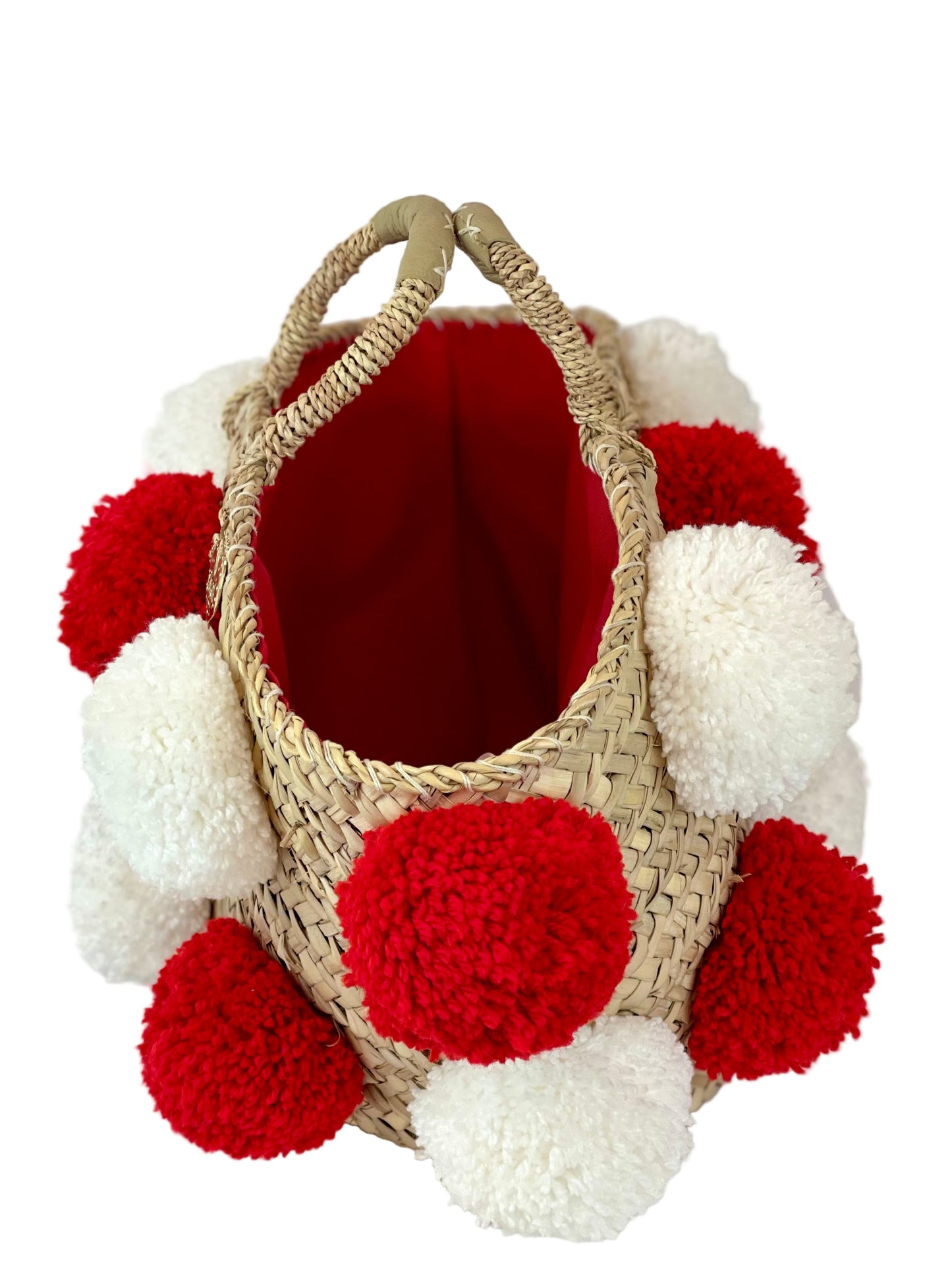 Basket with handmade white and red pom poms