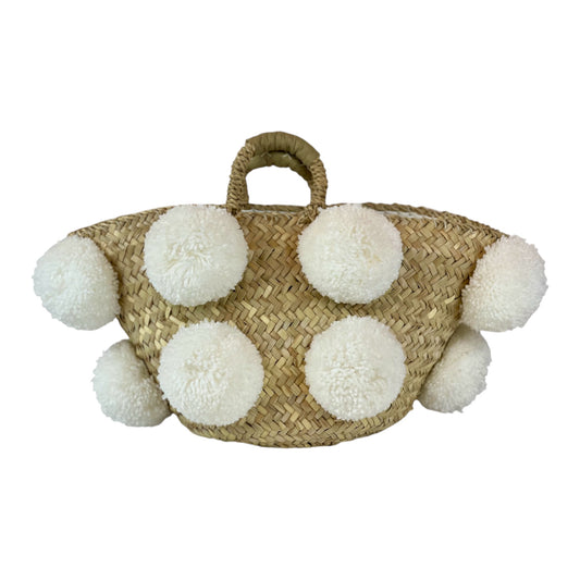 Basket with white handmade pom poms