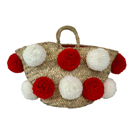 Basket with handmade white and red pom poms