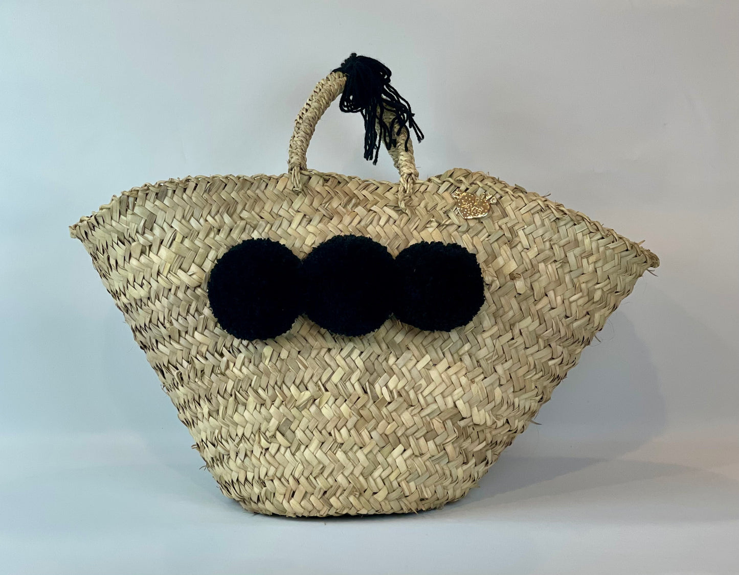Basket with black pom pom 