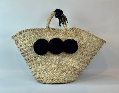 Basket with black pom pom 