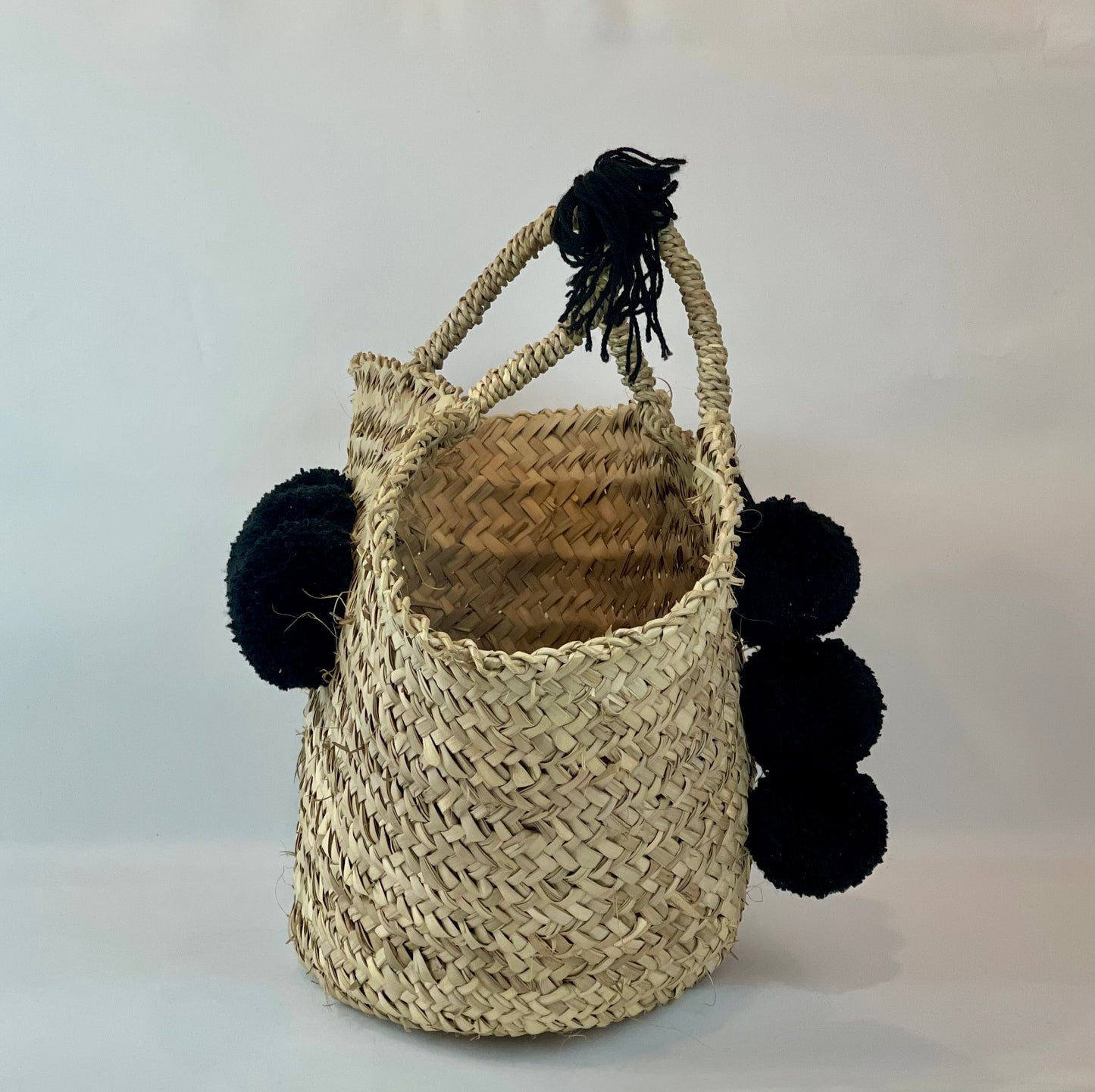 Basket with black pom pom 
