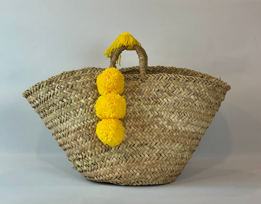 Basket with yellow pom pom