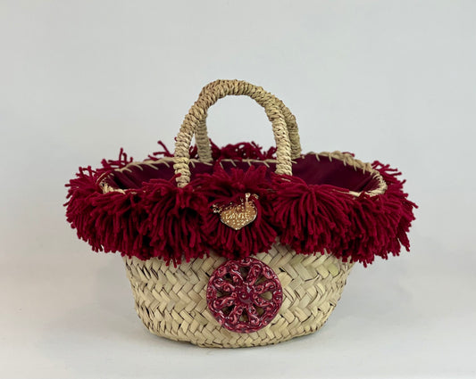 Basket with ceramic Maiden and fuchsia fringes
