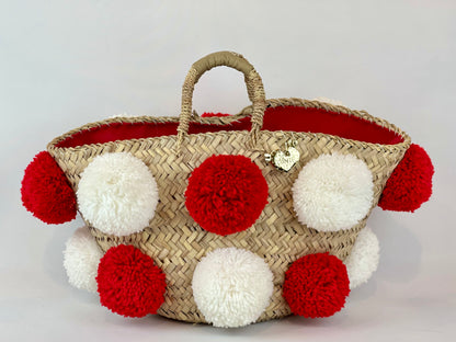 Basket with handmade white and red pom poms