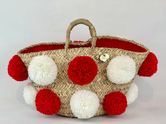 Basket with handmade white and red pom poms