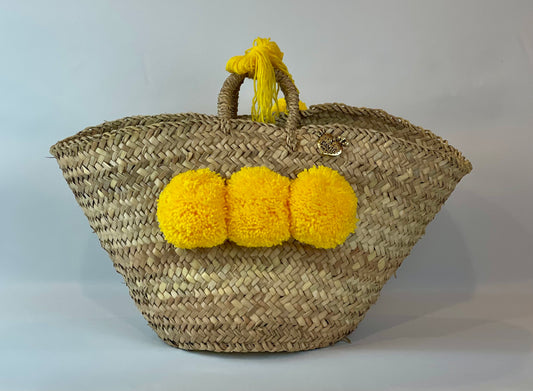 Basket with yellow pom pom