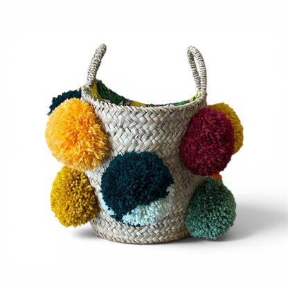 Basket with handmade white and red pom poms