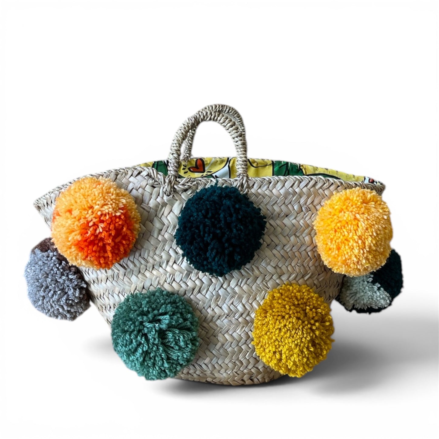 Basket with handmade white and red pom poms